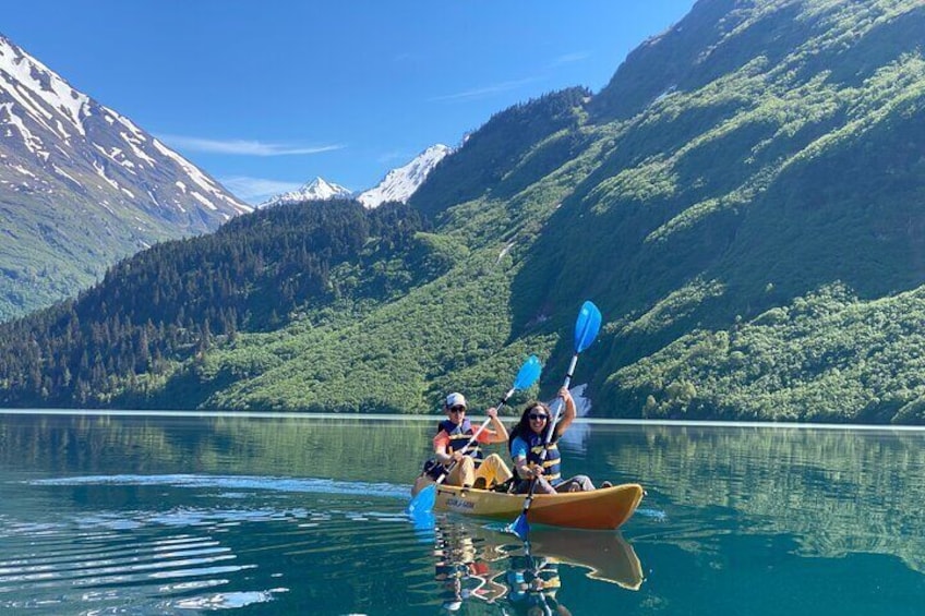 A honeymoon paddle on the mirror like waters of Glacial Grant Lake.