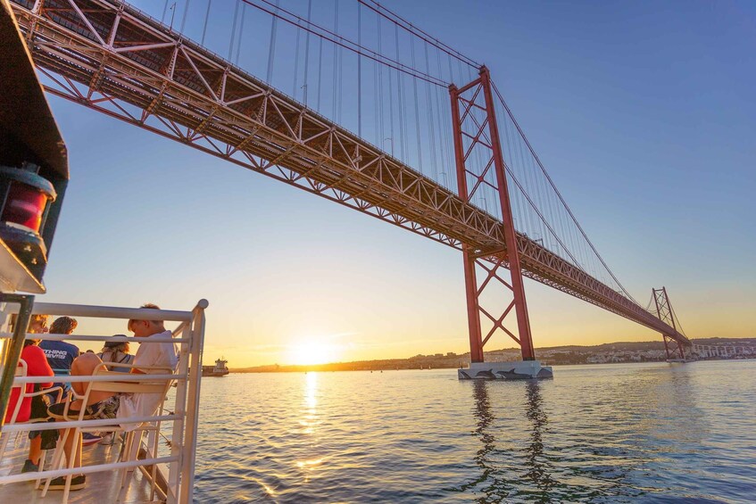 Picture 2 for Activity Lisbon: Tagus River Sunset Tour with Snacks and Drink