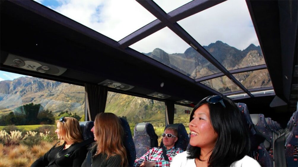 Group of people on a tour bus in New Zealand