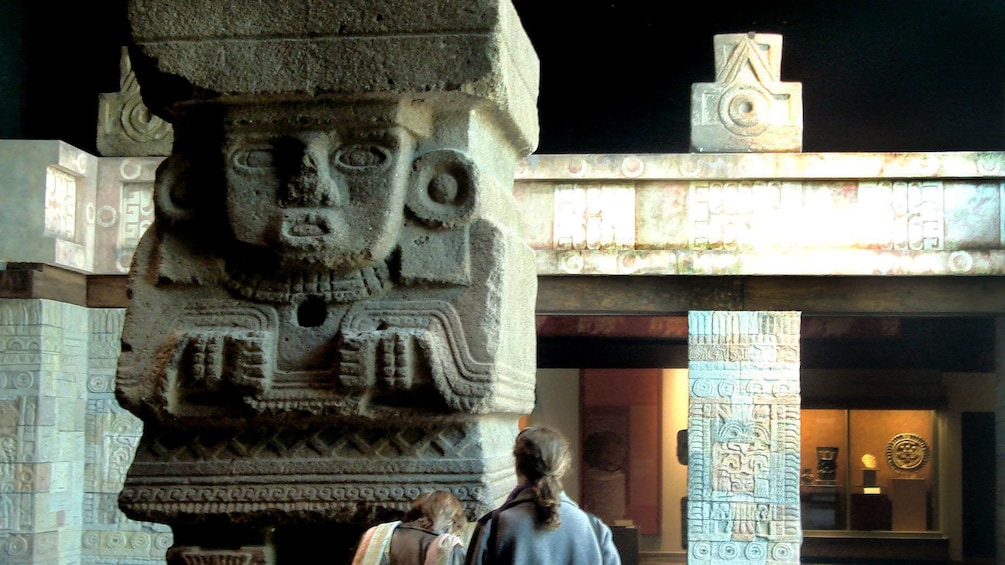 Large sculpture of human in anthropology museum in Mexico City