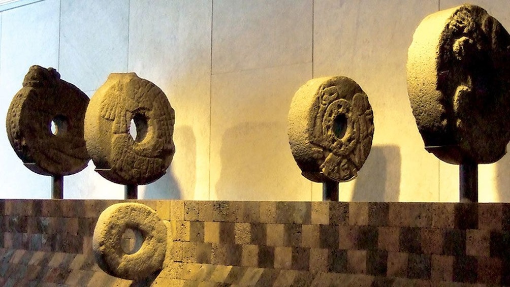 circular carved stone sculptures in anthropology museum in Mexico City