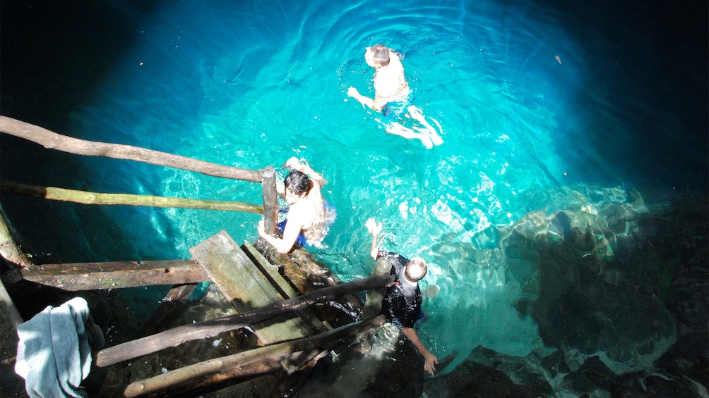 Guests swimming on the Cuzama Cenotes Tour