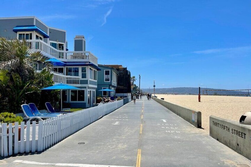 Hermosa Beach bike and pedestrian path. Speed limit is 8 mph and bikes must be pedaled safely.