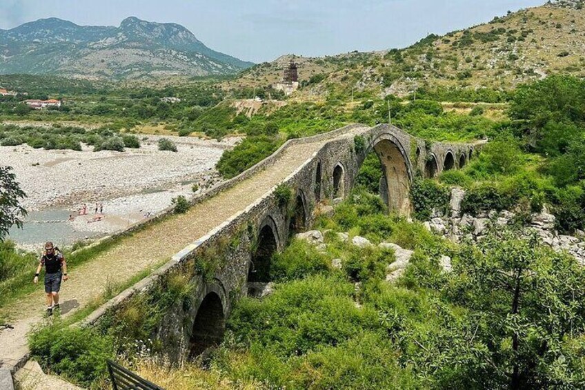 Walking through history on Shiroka Bridge.