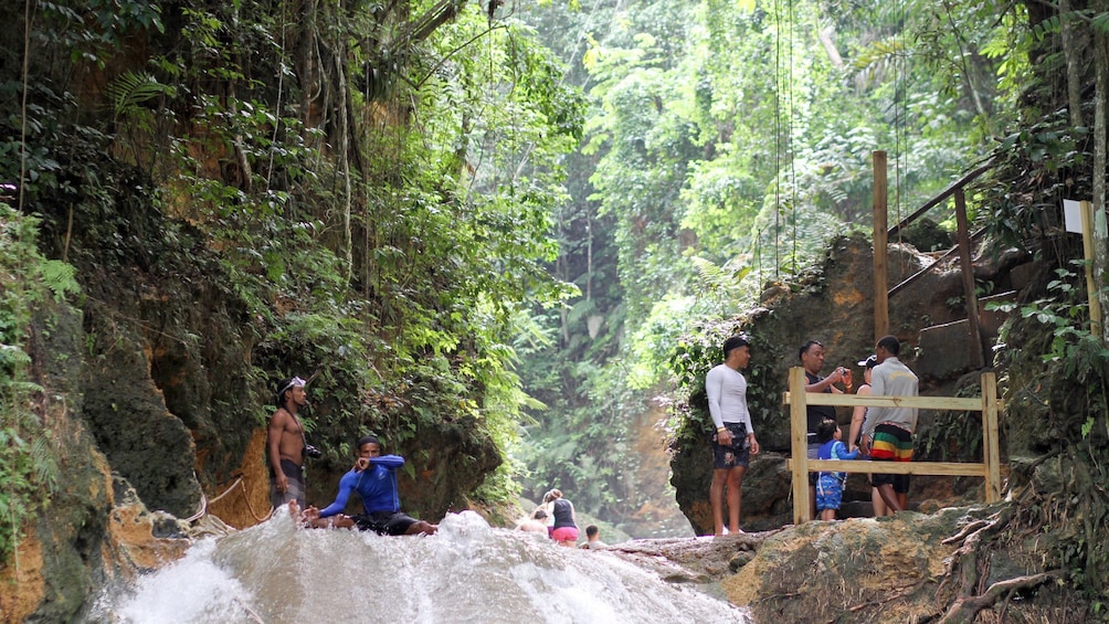 Tourists enjoying water falls in South Coast