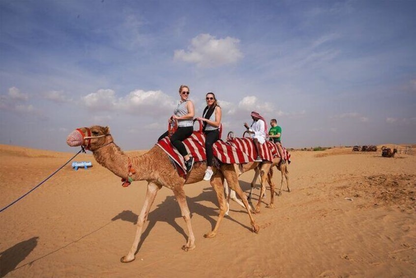 Desert Safari with Dune Bashing, Camel Ride, BBQ Dinner, Sand Board & Live Shows