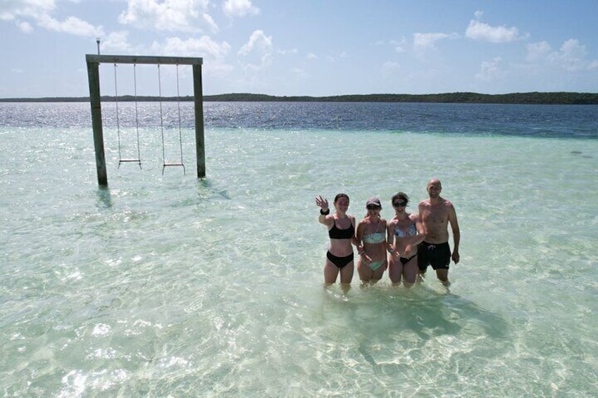 Shallow sandbar complete with wooden swings that make for an amazing photo opportunity.