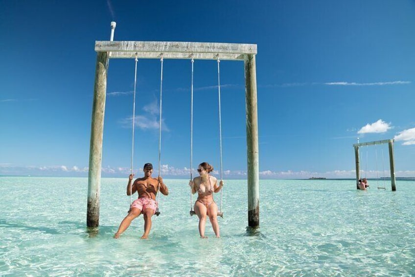 Shallow sandbar complete with wooden swings that make for an amazing photo opportunity.