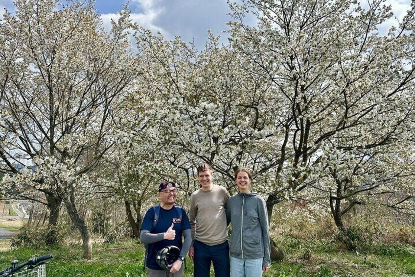 Captured with a cherry tree in full bloom in the background, perfectly timed as the guests arrived.