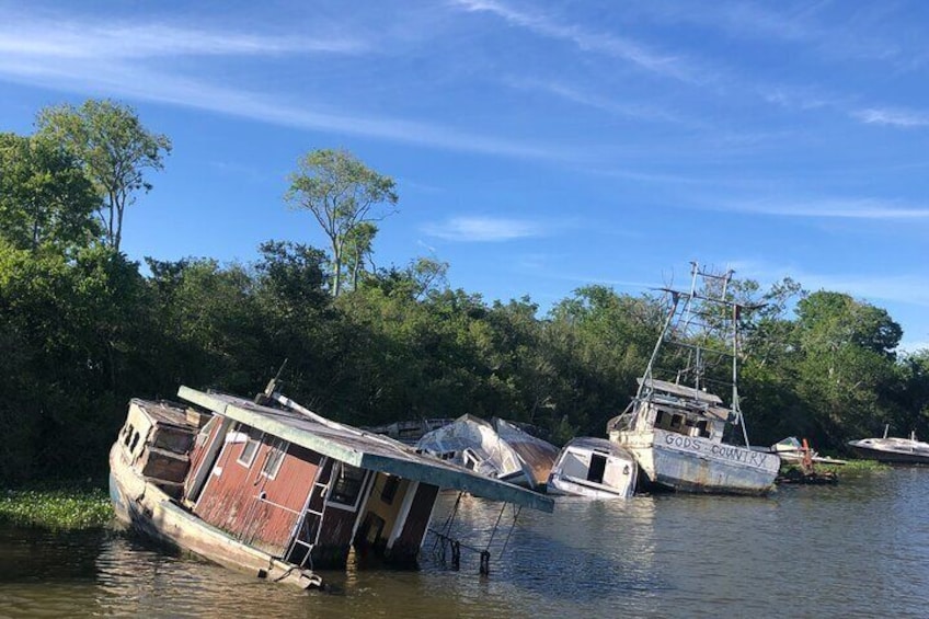 Explore a funky boat graveyard on this easy paddle just minutes from the quarter.