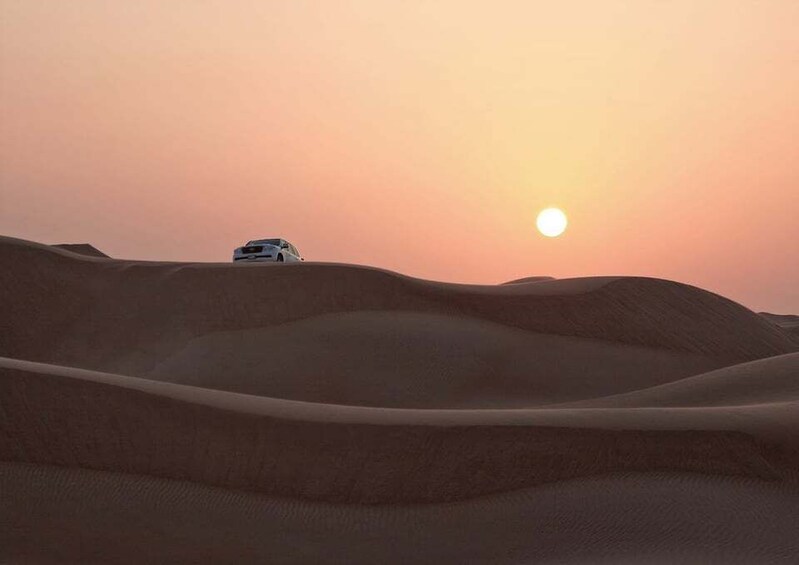 Doha: Sunrise, Dune Bashing, Camel Ride, & Sand Boarding