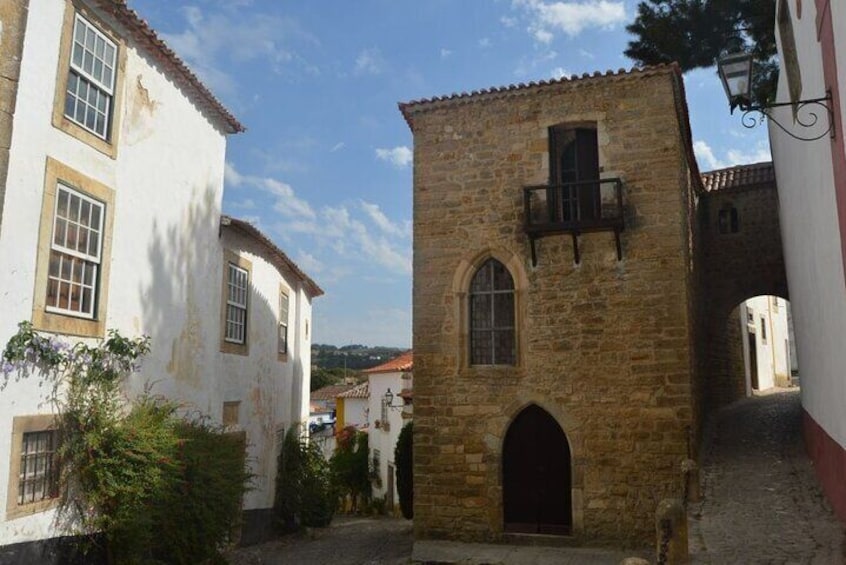 Private Guided Day Tour: Lisbon to Nazaré & Óbidos Medieval Town 