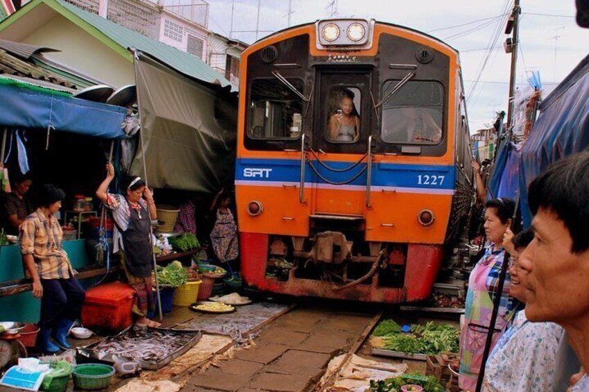 Stroll to the floating and railway market of Samut Song Kram with your own english speaking guide.