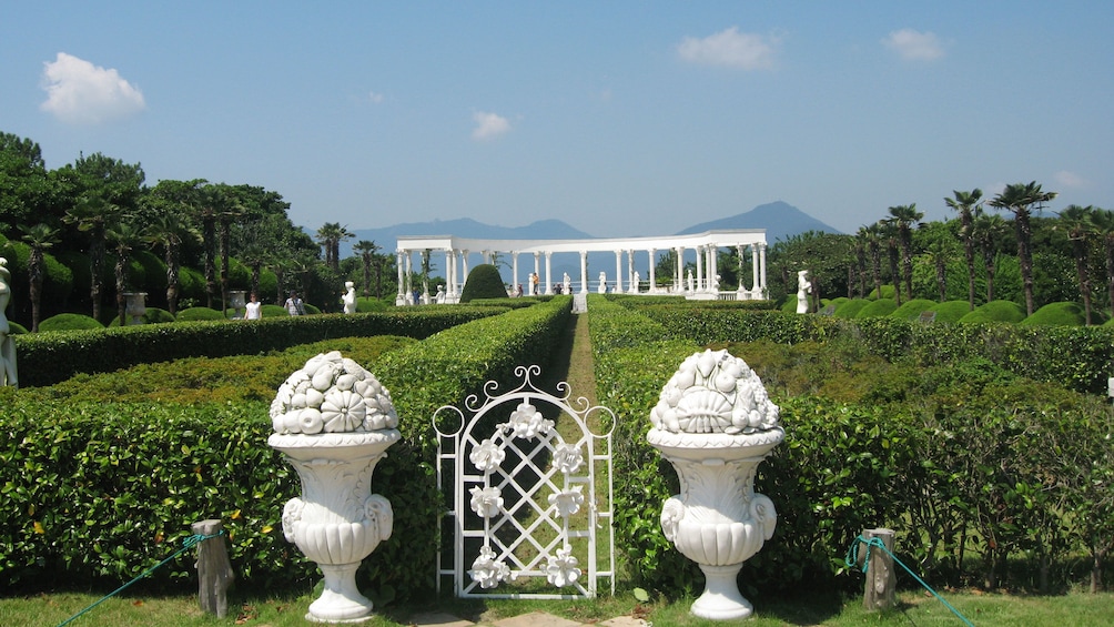 Sprawling view of statues and vegetation in Oedo Botania.