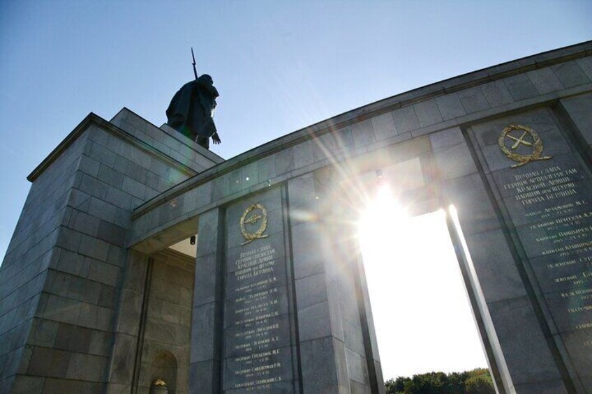 Walk through the bombastic Soviet War Memorial in the Tiergarten park