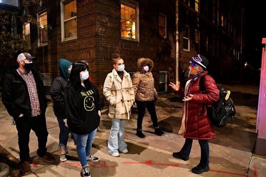 Ghost tour guide telling ghost stories in Newport, Rhode Island on a Haunted Newport Ghosts Tour