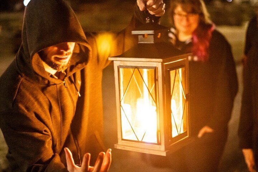 Ghost tour guide telling ghost stories in Newport, Rhode Island on a Haunted Newport Ghosts Tour