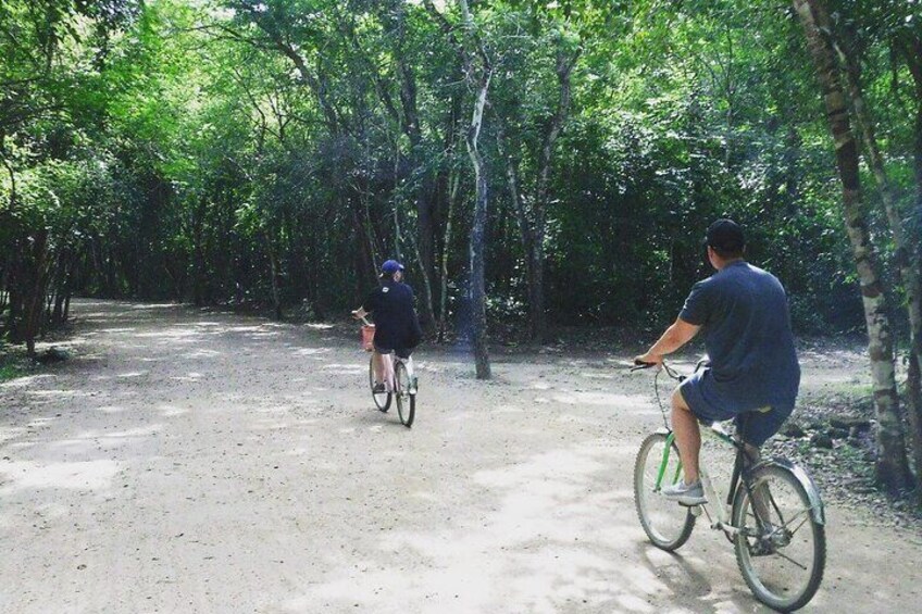 Biking through the jungle at the Cobá Ruins.