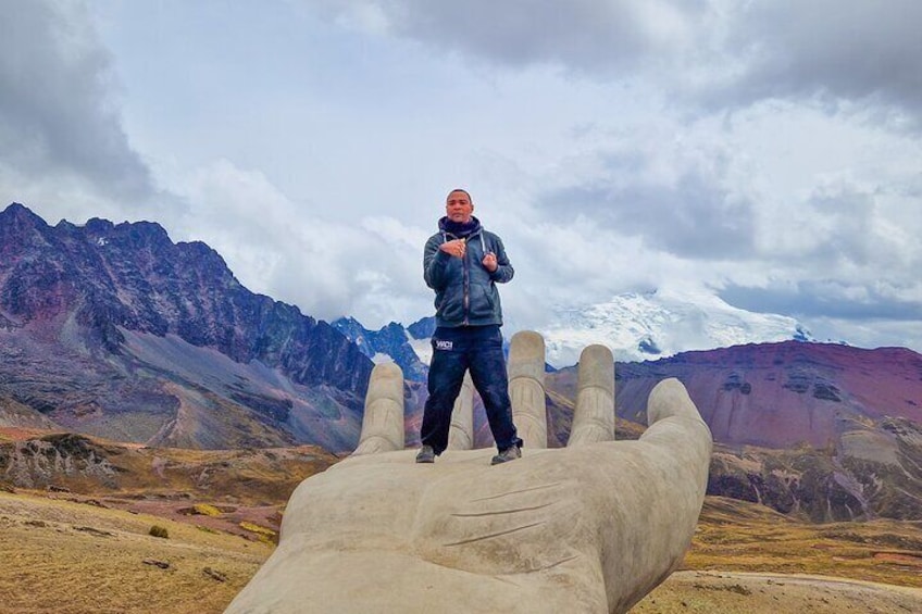 Rainbow Mountain hand, in the back Ausangate Mountain