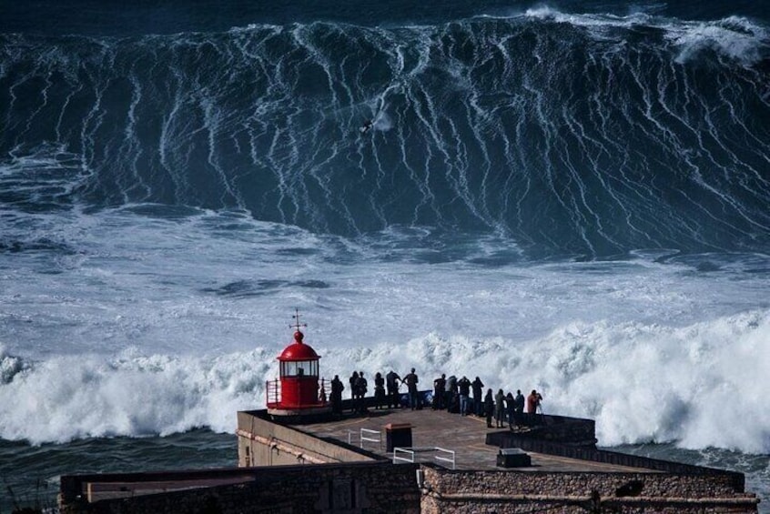 Nazare lighthouse with giant waves