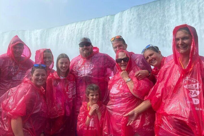 Family getting up close and personal with Niagara Falls on the iconic boat tour