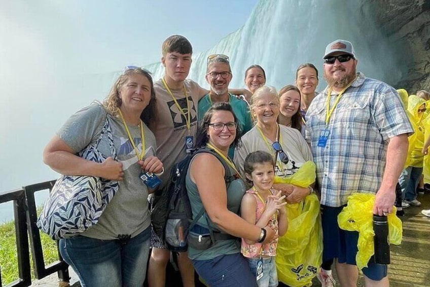 A family enjoying their journey behind the falls