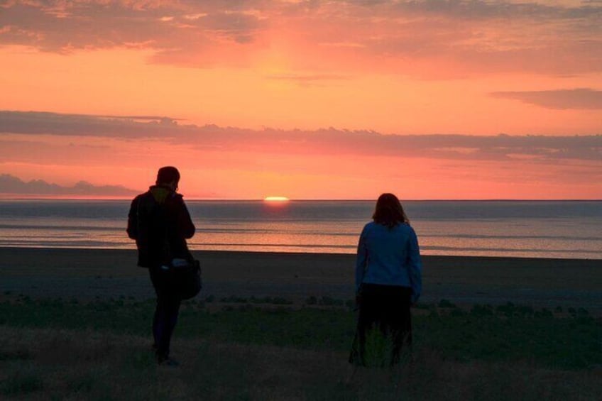 Taking pictures of sunrise over the sea