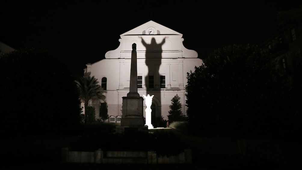 Shadow of statue casted upon building in New Orleans