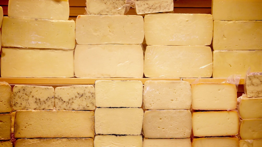 Stacks of different cheeses seen on Athens food tour