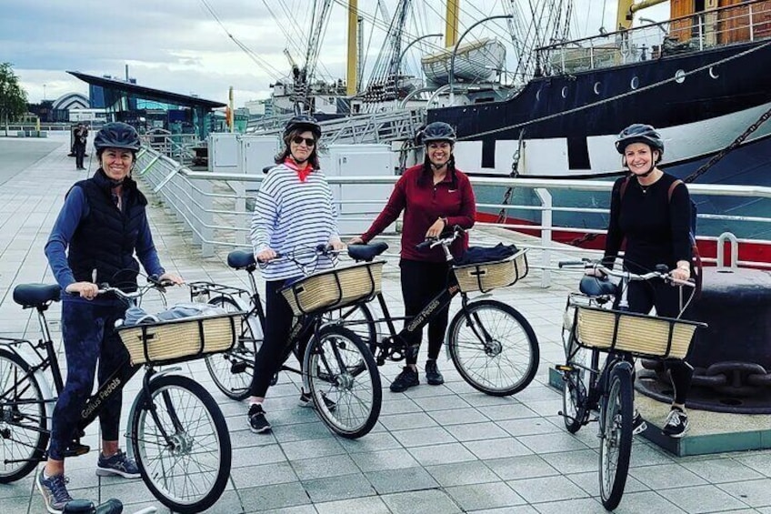 'Gallus Pedals Glasgow Bike Tour' taking advantage of a photo op on the Tall Ship by the Riverside Museum