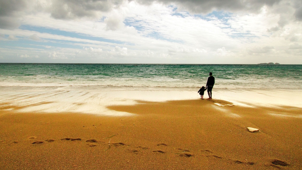 Father and child on the beach along the Amalfi Coast