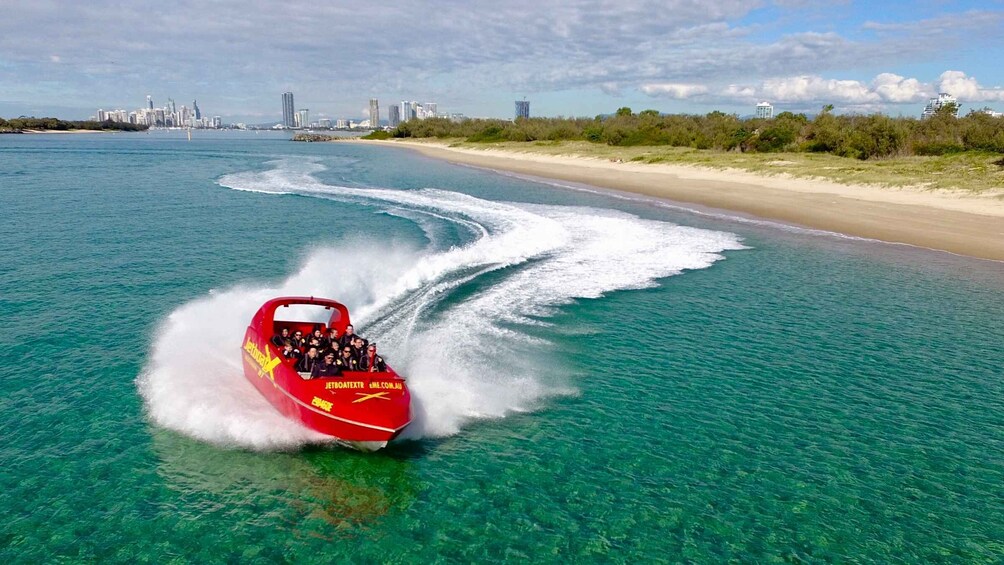 Picture 1 for Activity Surfer's Paradise: Jetboat Ride and Surf Lesson