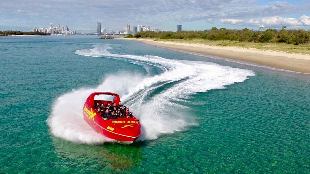 Picture 1 for Activity Surfer's Paradise: Jetboat Ride and Surf Lesson