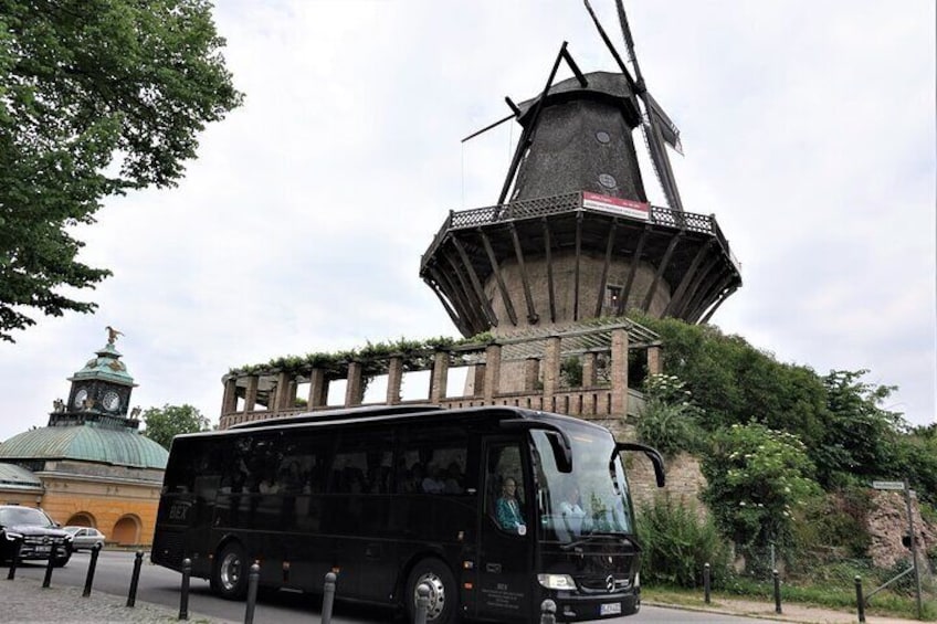 Bus with guide in Potsdam at windmill
