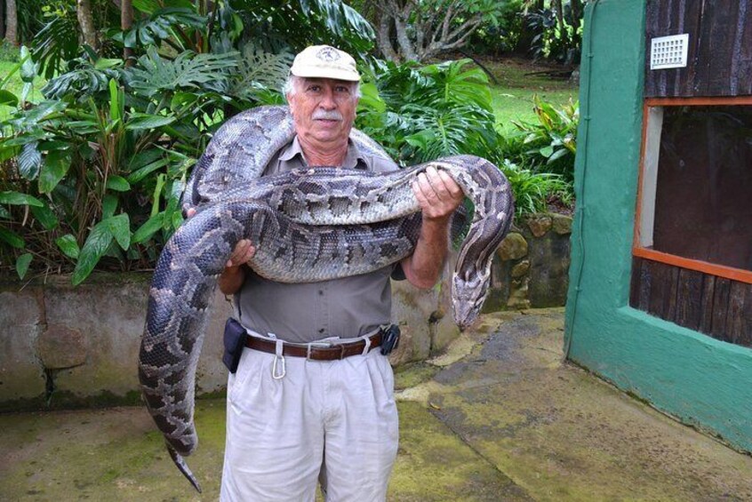 Sotiris holding a python at the reptile park