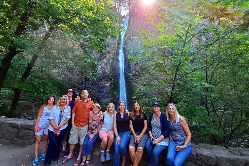 Horsetail Falls offers a beautiful backdrop for this family's photo opportunity while out on tour