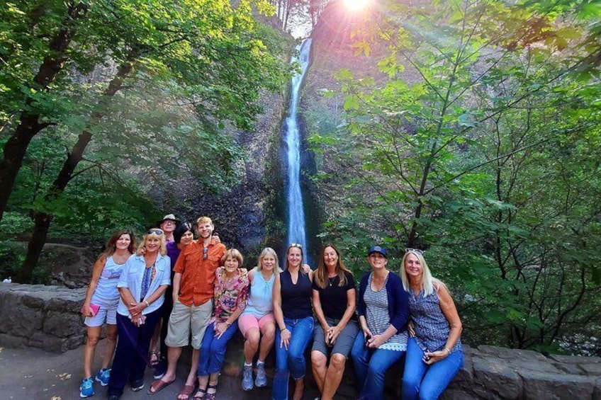 Horsetail Falls offers a beautiful backdrop for this family's photo opportunity while out on tour