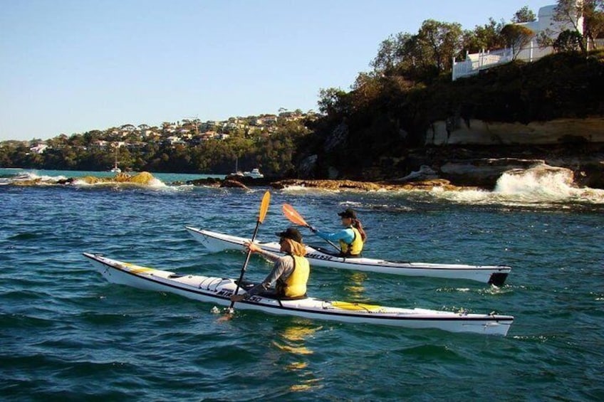Paddling two single deluxe (fibreglass) kayaks