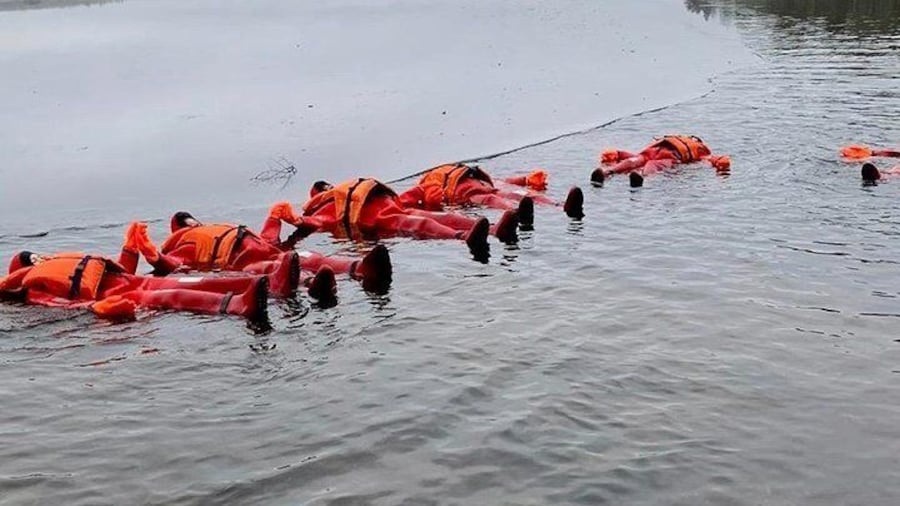 Red suit "Saimaa seals" floating