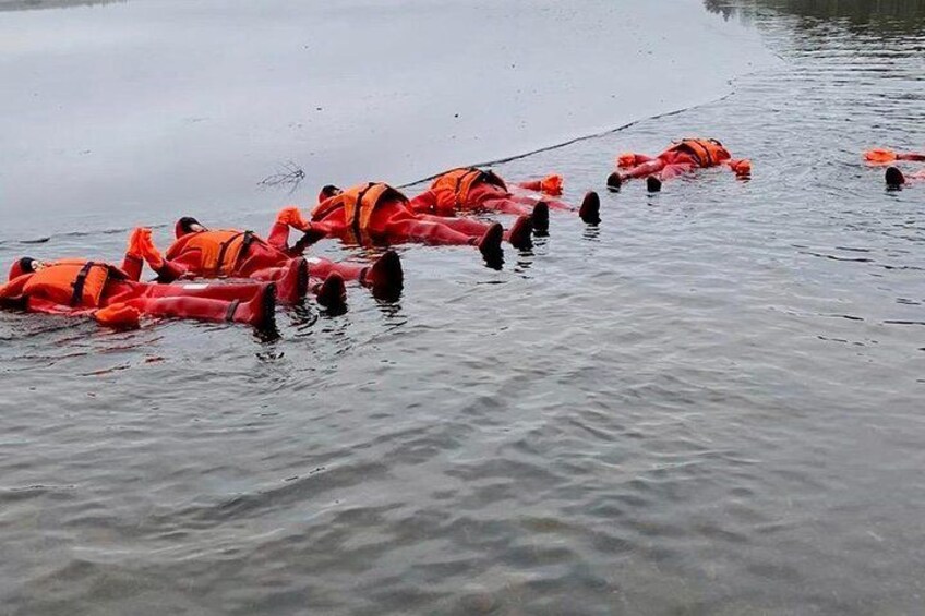 Red suit "Saimaa seals" floating