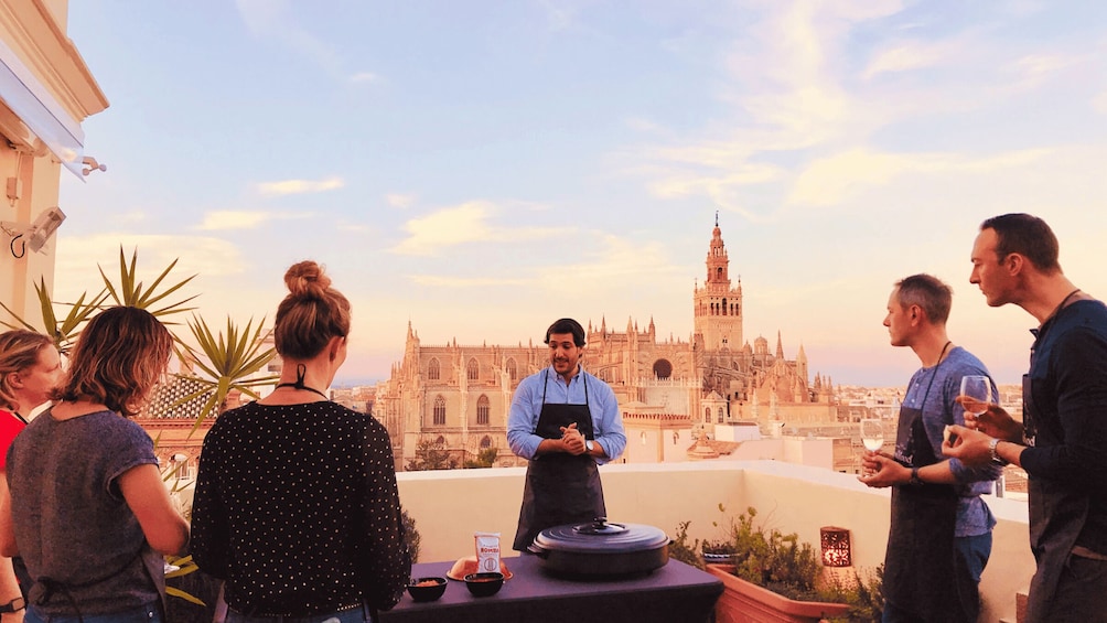 Picture 1 for Activity Seville: Highlights Rooftop Tour & Paella Cooking Class