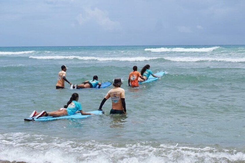 Surfing lesson at beautiful beach Playa Encuentro