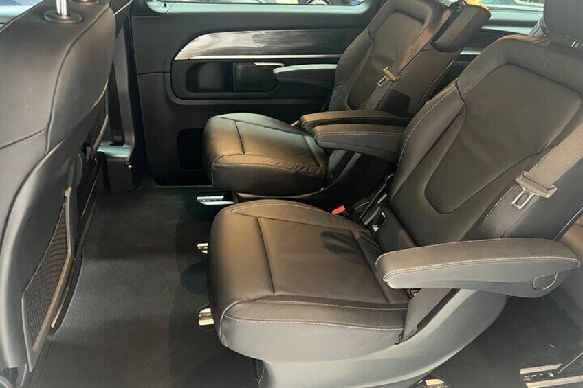 Luxury silver Mercedes interior with captains chairs