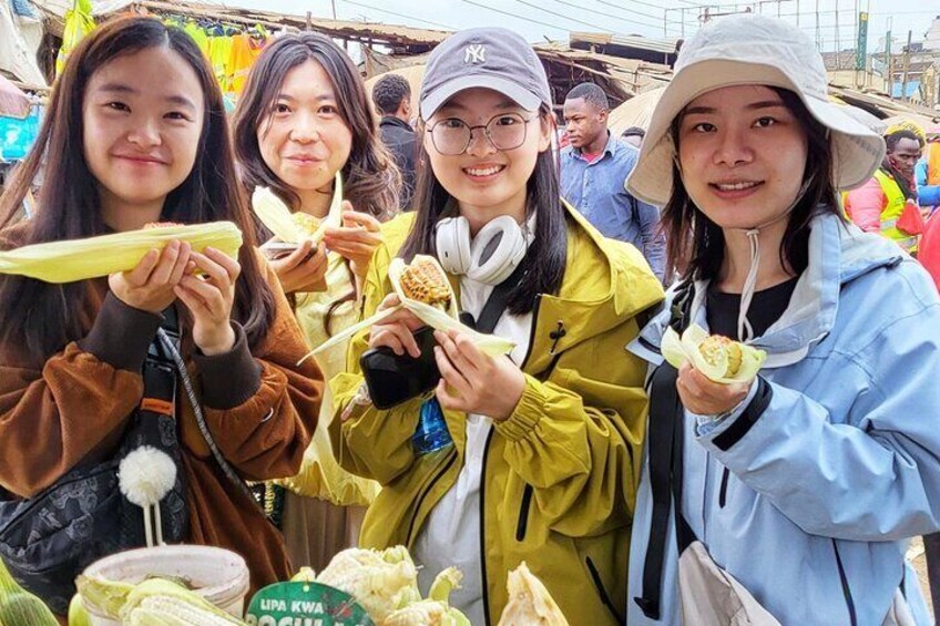 Trying local street food in Nairobi market