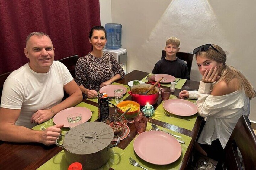 Guests enjoying a Kenyan home cooked dinner 