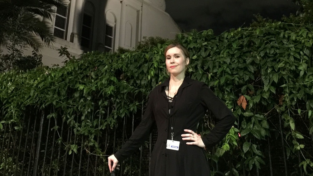 Show item 1 of 5. Tour guide at night in the French Quarter in New Orleans