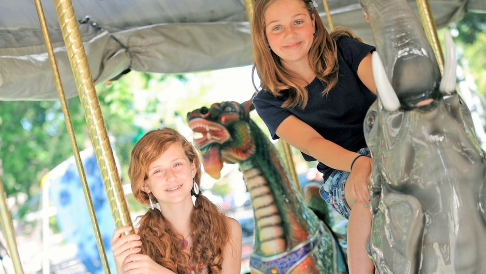 Girls enjoying the Parx Liberty Carousel at Franklin Square