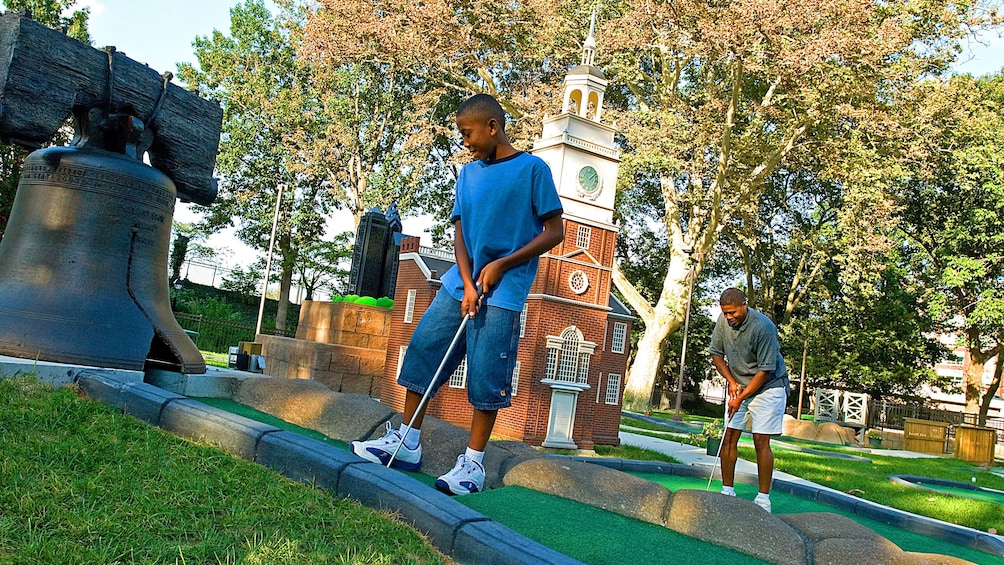 Father and son Putt Putt Golfing