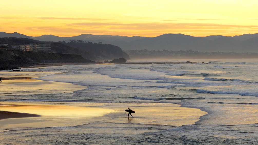 Surfer on the beach in San Sebastian