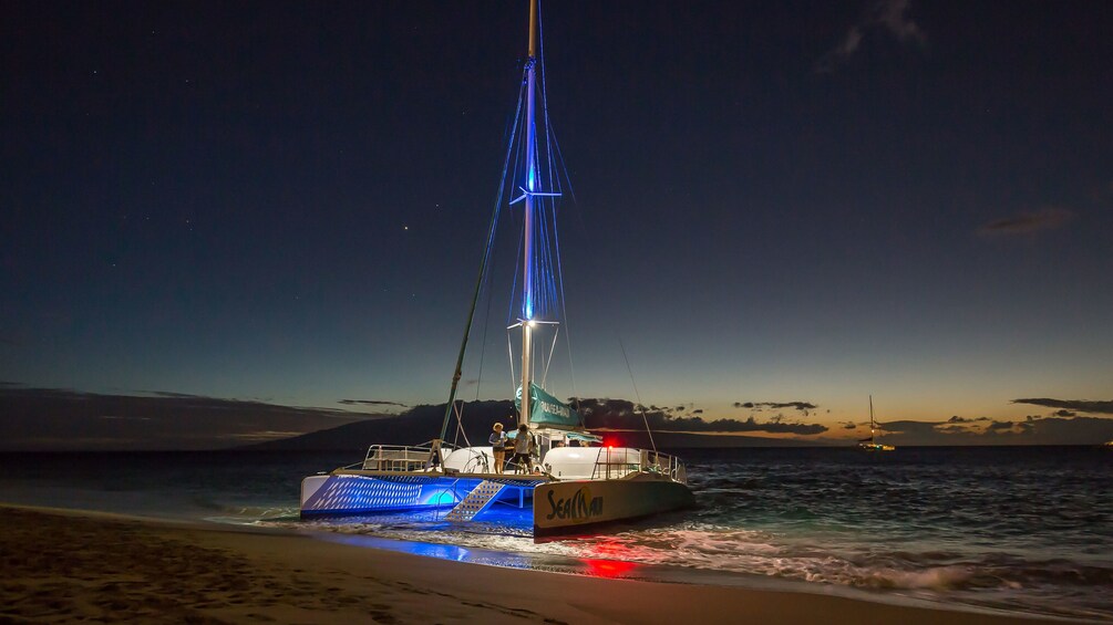 Catamaran on the beach at night on Maui